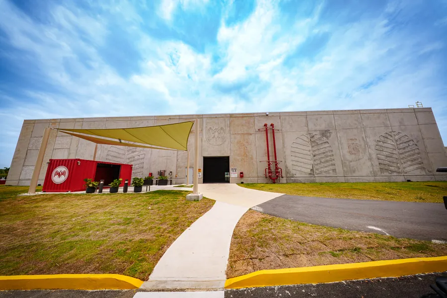 New BACARDÍ aging warehouse in Cataño, Puerto Rico: concrete building with entrance and shade sail