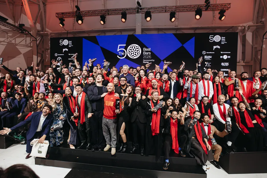 Cointreau at The 50 Best Bars 2026 in Milan: bartenders wearing red scarves celebrate on stage