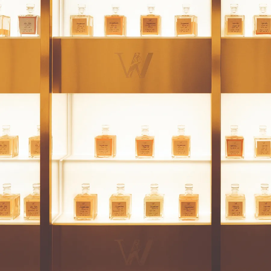 Johnnie Walker Vault: whisky samples in labelled glass flasks on illuminated shelves